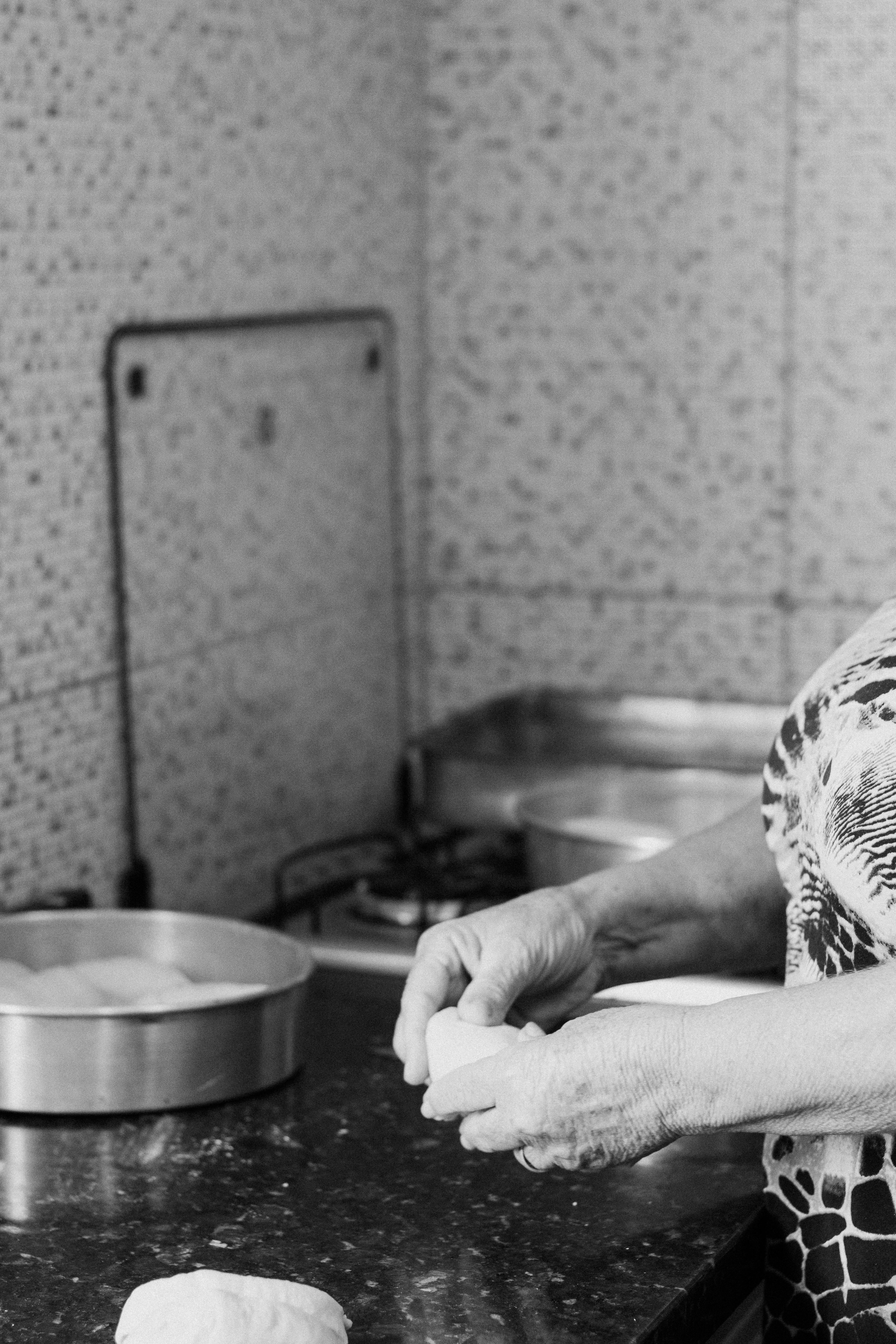 Grandma's hands kneading dough