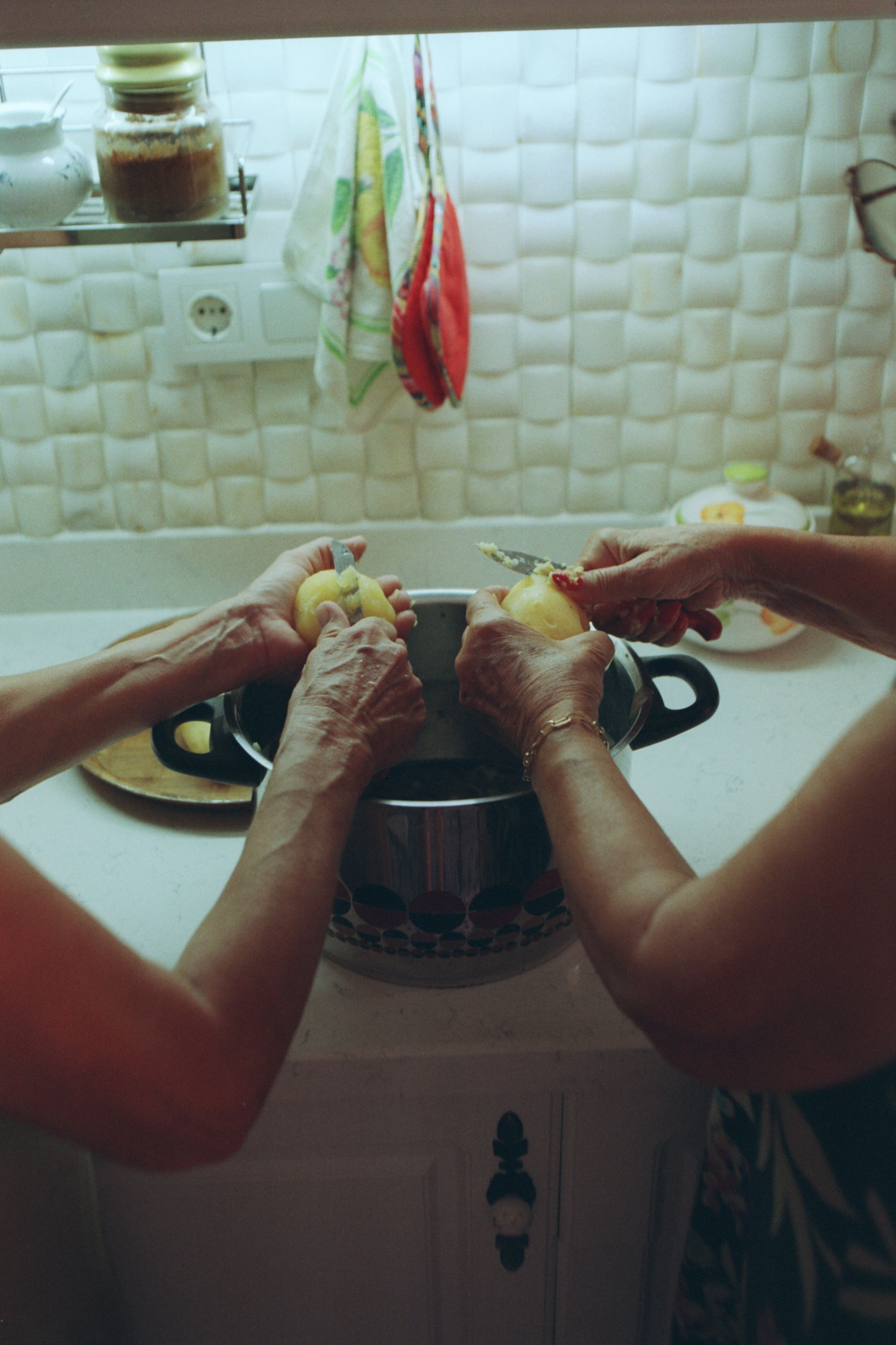 Grandma and Aunt Maria peeling potatoes